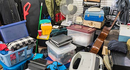 Cluttered room with  overflowing storage issues